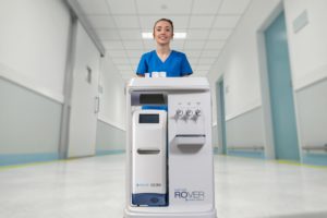Nurse pushing portable dialysis cart